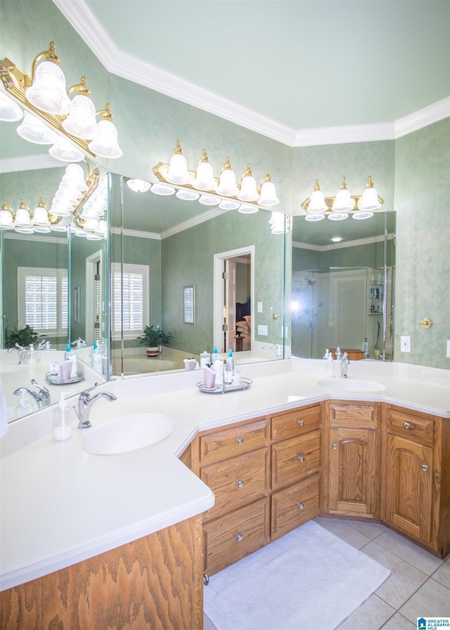 bathroom with tile patterned floors, vanity, ornamental molding, and a shower with door