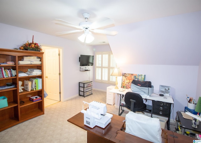 carpeted office featuring ceiling fan and lofted ceiling