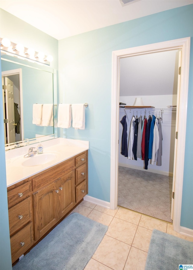 bathroom featuring tile patterned floors and vanity