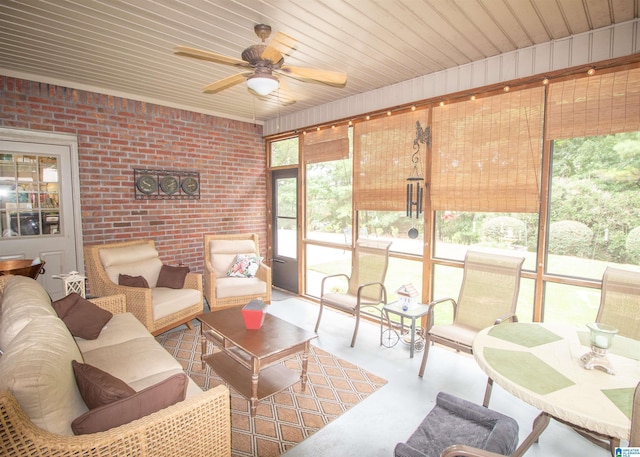 sunroom featuring ceiling fan