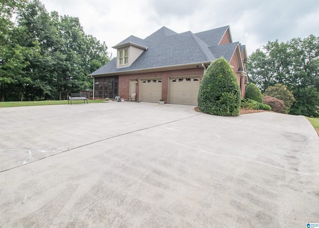 view of property exterior with a sunroom