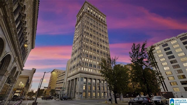 view of outdoor building at dusk