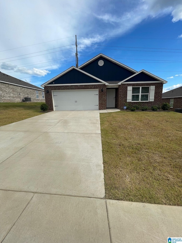 ranch-style home with a front yard and a garage