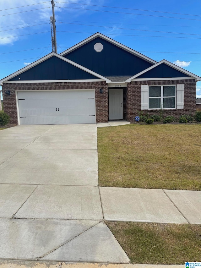 ranch-style home with a front lawn and a garage