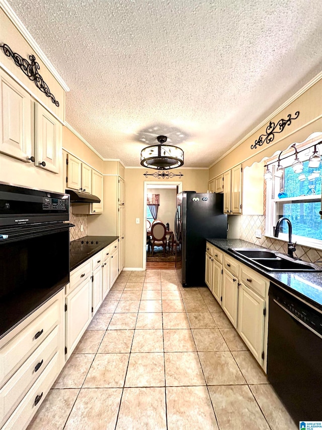 kitchen with light tile patterned flooring, black appliances, tasteful backsplash, ornamental molding, and sink