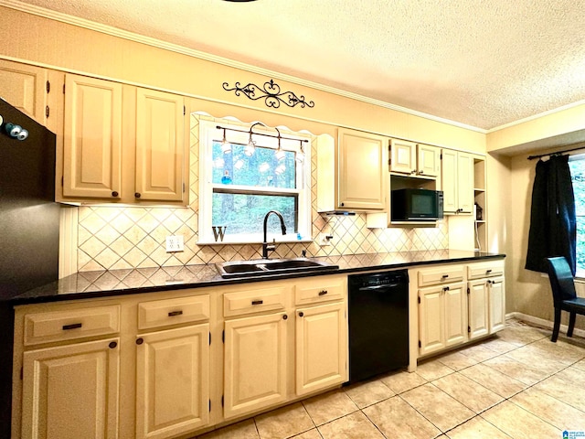 kitchen featuring tasteful backsplash, light tile patterned floors, black appliances, sink, and ornamental molding