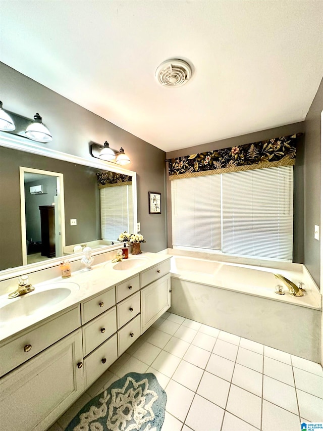 bathroom with a tub, tile patterned floors, and double vanity