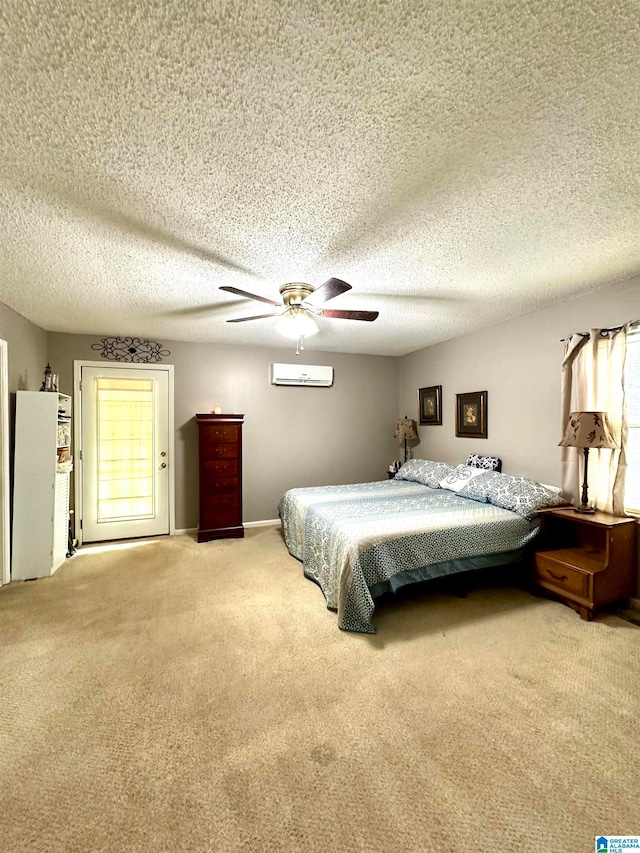 carpeted bedroom with multiple windows, a textured ceiling, and ceiling fan