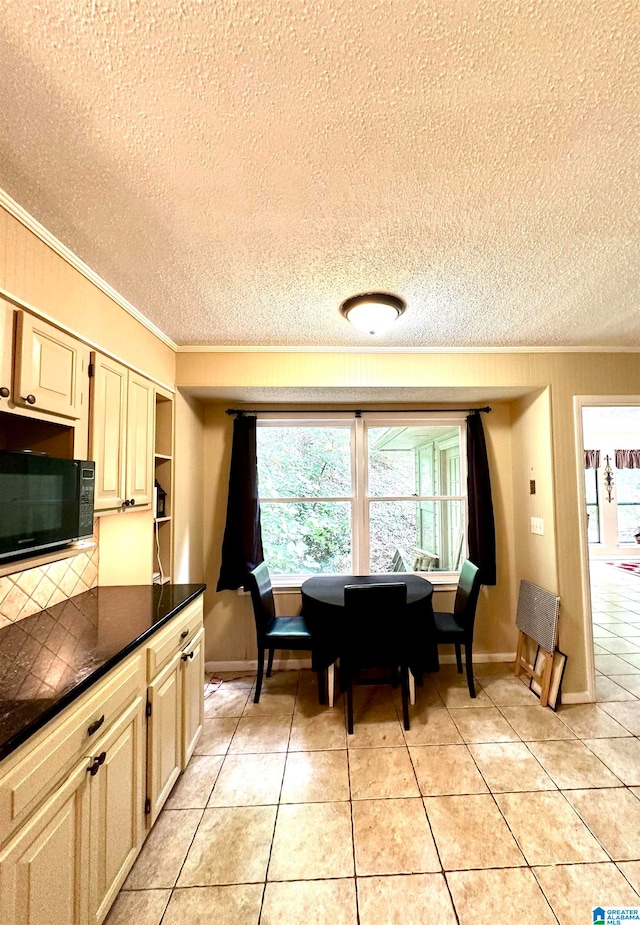 interior space with a textured ceiling and crown molding