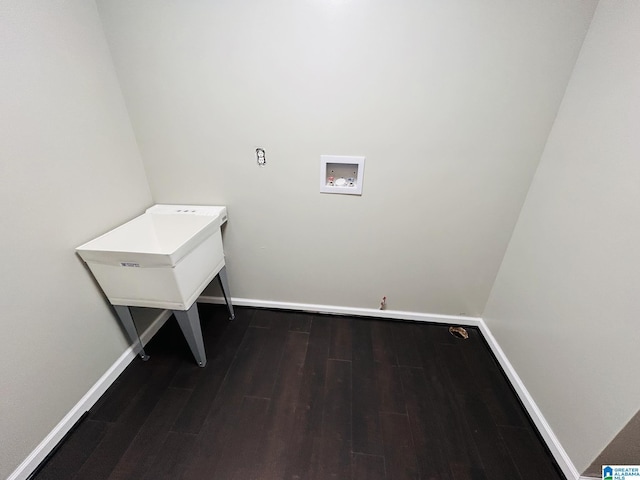 laundry room with laundry area, dark wood-type flooring, baseboards, and washer hookup