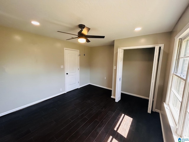 unfurnished bedroom featuring recessed lighting, ceiling fan, baseboards, and dark wood-style flooring