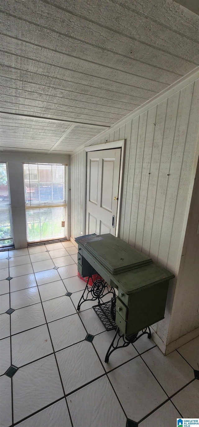 unfurnished sunroom featuring wood ceiling