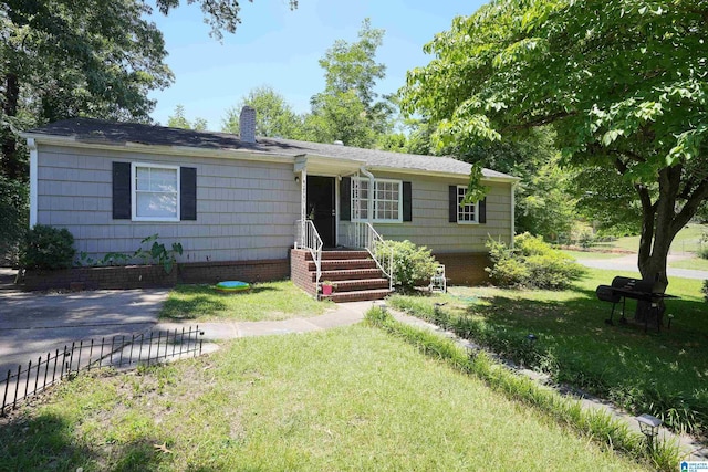 ranch-style house with a front yard