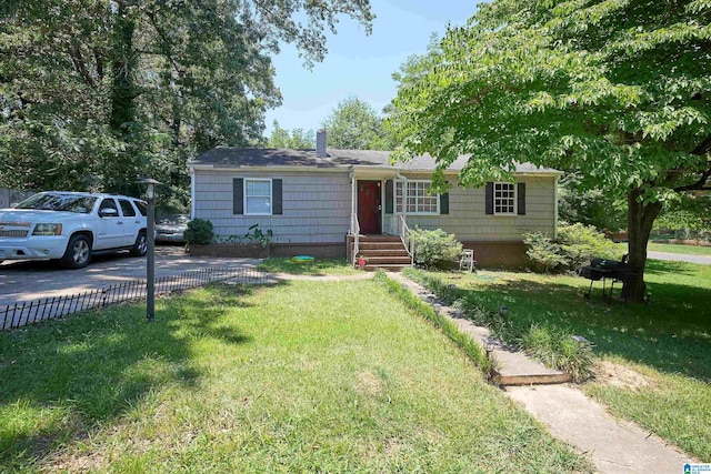 ranch-style home with a front yard