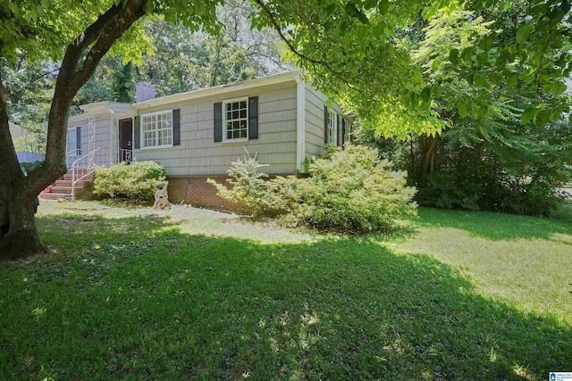 view of home's exterior featuring a yard