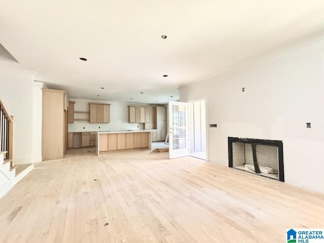 unfurnished living room featuring light hardwood / wood-style flooring