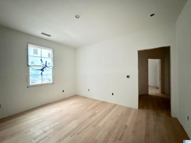 unfurnished room featuring light hardwood / wood-style flooring