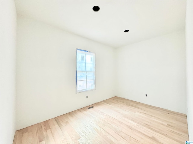 spare room with light hardwood / wood-style flooring