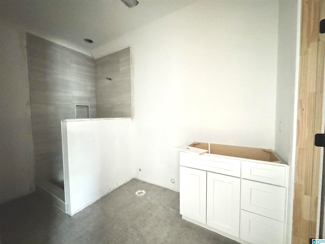 bathroom with concrete floors