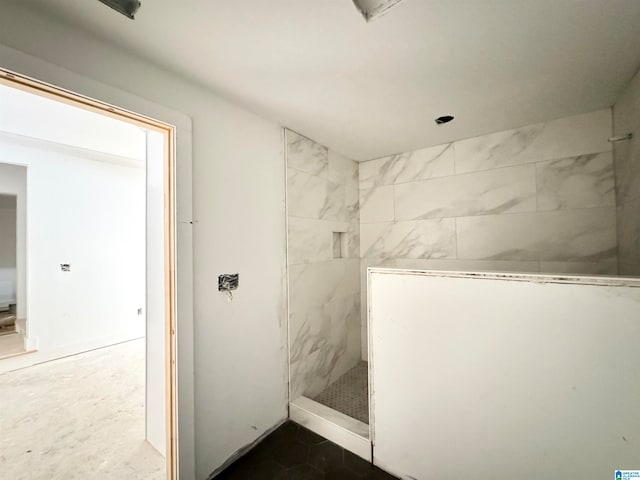 bathroom with tiled shower