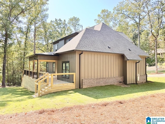 view of home's exterior with a lawn