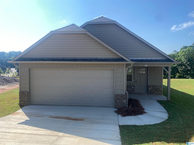 view of front facade featuring concrete driveway, brick siding, a front lawn, and an attached garage