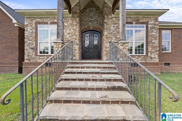 property entrance featuring french doors