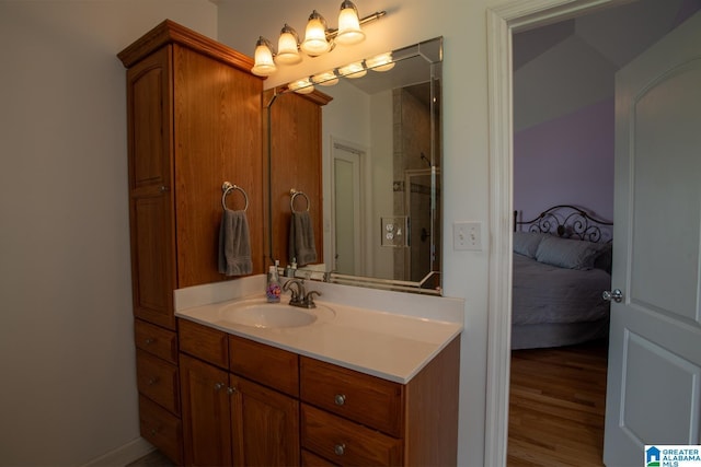 bathroom with hardwood / wood-style flooring and vanity