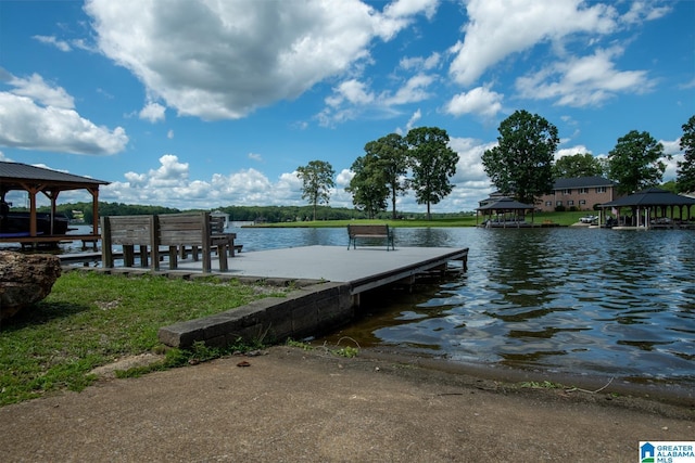 view of dock featuring a gazebo and a water view