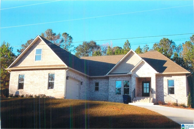 view of front of home with brick siding, roof with shingles, and an attached garage