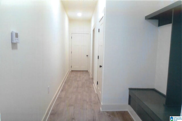 corridor featuring light hardwood / wood-style floors