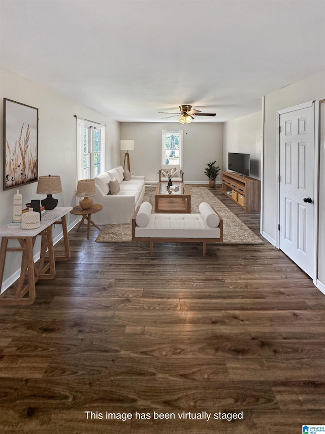 living room with ceiling fan, dark hardwood / wood-style flooring, and a wealth of natural light