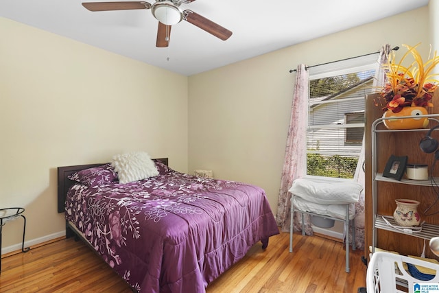 bedroom featuring wood-type flooring and ceiling fan