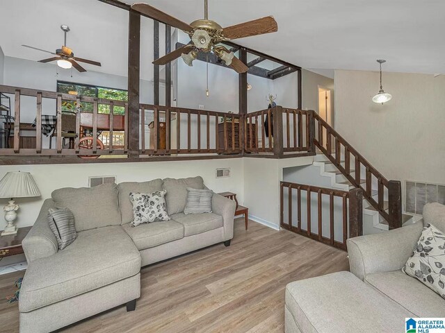 entryway featuring hardwood / wood-style flooring and vaulted ceiling