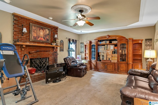 carpeted living room with ceiling fan and a fireplace