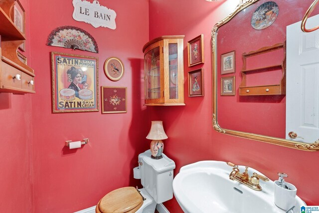 bathroom with sink and toilet