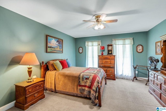 bedroom with light colored carpet and ceiling fan