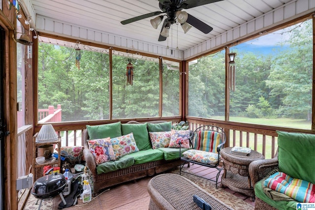 sunroom featuring ceiling fan