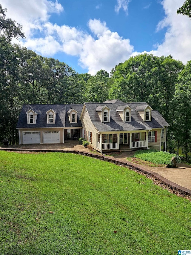 cape cod-style house with a porch, a front yard, and an attached garage