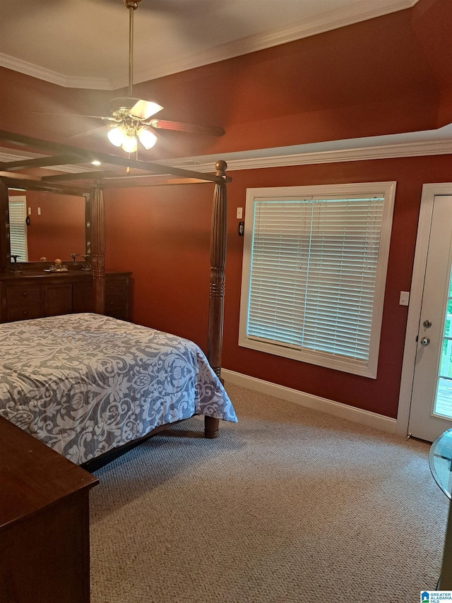 carpeted bedroom featuring crown molding, baseboards, and a ceiling fan