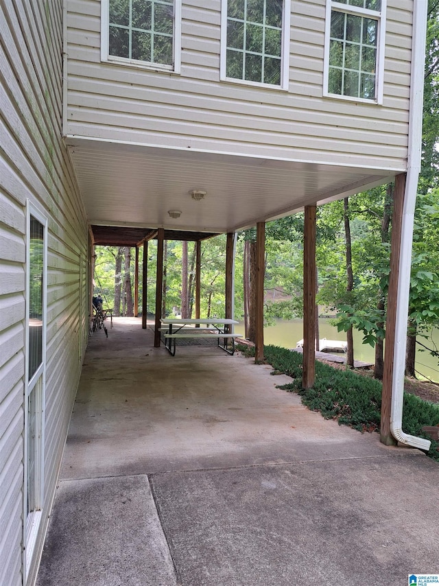 view of patio featuring a carport and driveway