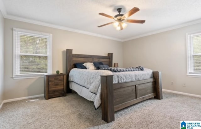 bedroom with ornamental molding, light carpet, and ceiling fan