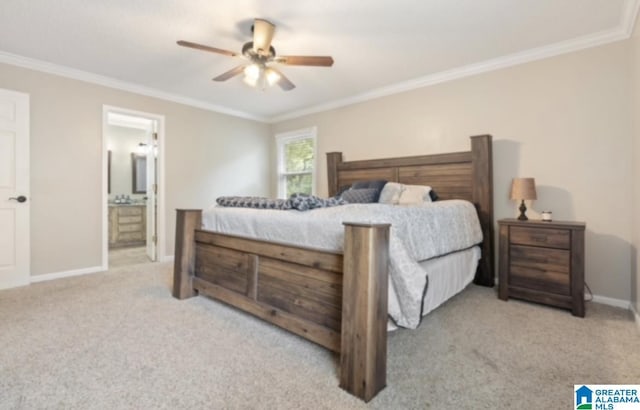 carpeted bedroom featuring crown molding, ceiling fan, and ensuite bathroom