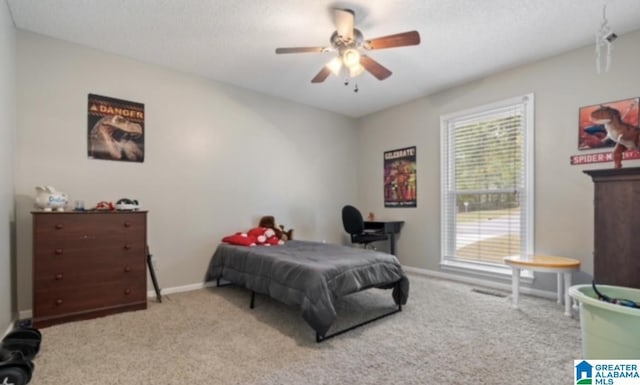 bedroom featuring ceiling fan and light colored carpet