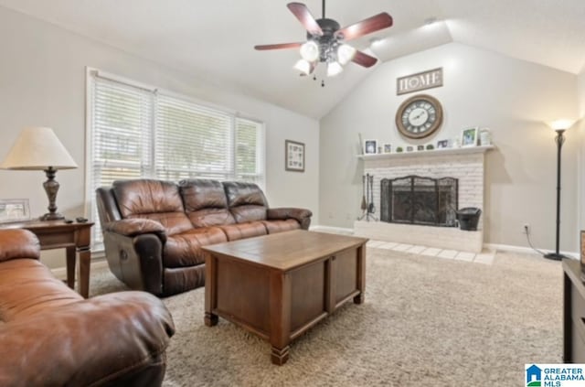 carpeted living room featuring ceiling fan, vaulted ceiling, and a brick fireplace