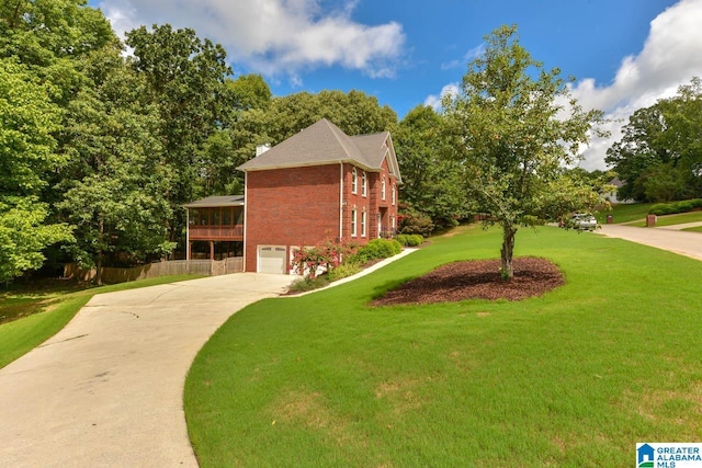 view of property exterior featuring a lawn and a garage