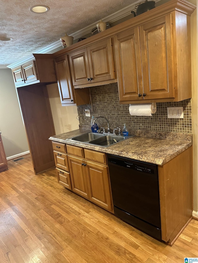 kitchen featuring sink, black dishwasher, ornamental molding, light hardwood / wood-style floors, and decorative backsplash