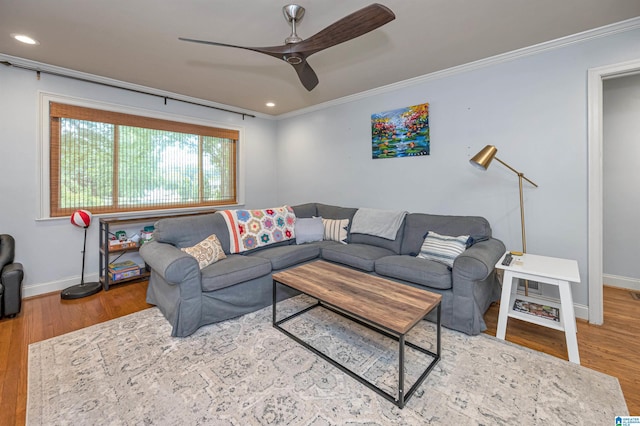 living room with baseboards, ornamental molding, recessed lighting, a ceiling fan, and wood finished floors