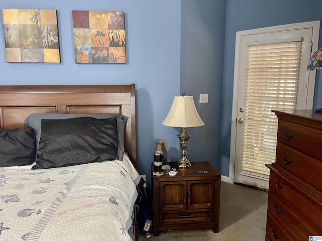 bedroom featuring light colored carpet