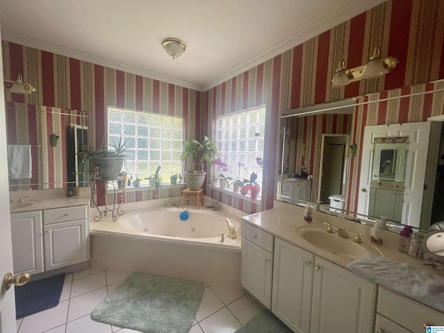 bathroom featuring vanity, a washtub, crown molding, and tile patterned floors